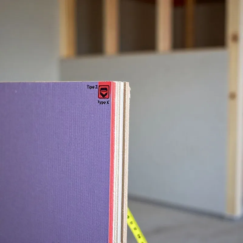 Fire-rated drywall installed on a garage wall relative to living space