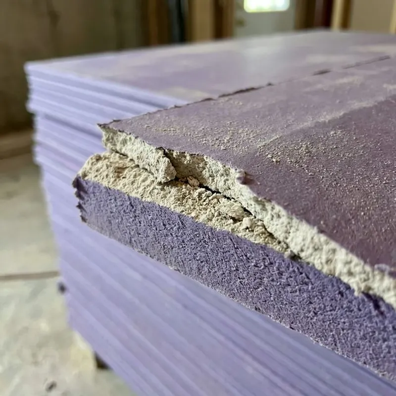 Close-up of purple board moisture-resistant drywall material and core