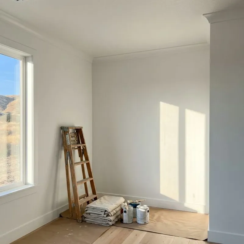 Beautifully finished residential room with smooth white drywall walls and ceiling ready for paint
